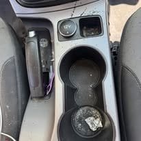 center console before ash and grime buildup — before professional detailing in Idaho Falls