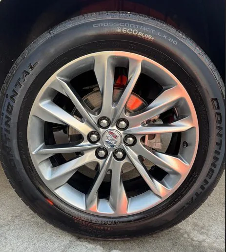 Buick wheel after exterior detail in Idaho Falls — gleaming alloy and dressed tire