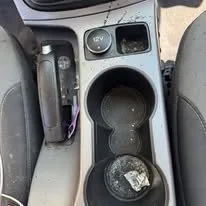 Center console before interior detail in Idaho Falls — ash and grime buildup
