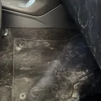 Floor mat before interior detail in Idaho Falls — heavily soiled carpet