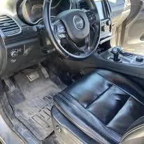 Jeep Grand Cherokee before interior detail in Idaho Falls — dirty mats and grimy leather
